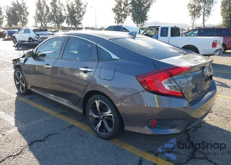 2016 Honda Civic Touring z USA, uszkodzony, nr VIN 19XFC1F95GE222046